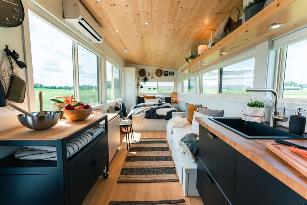 Open-concept kitchen and living space featuring best tiny home products for comfort and efficiency