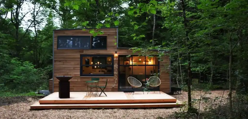 Forest Tiny Home with Warm Wooden Aesthetic tiny home builder cabin design in forest setting