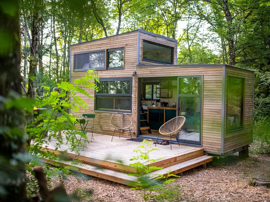 Compact Tiny Home in Cabin Style with Large Windows tiny home builder unit with minimalist wood exterior