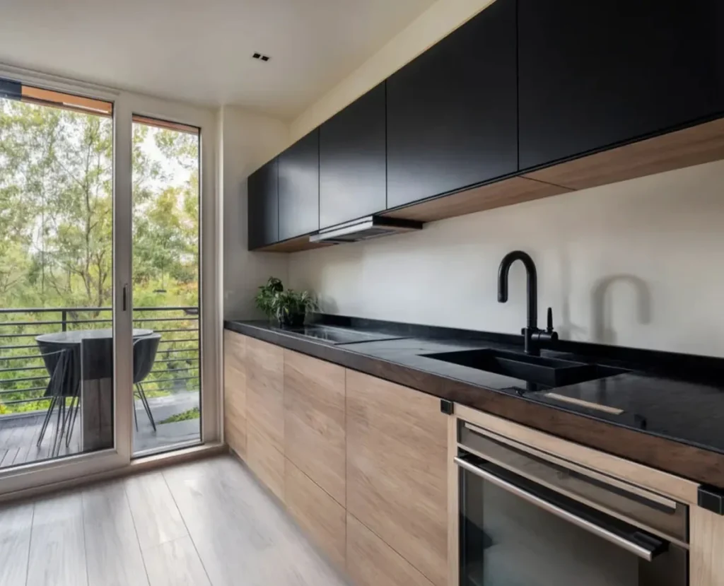 Kitchen Design in a Custom Built Tiny Home Minimalist kitchen in a custom built tiny home with black and wood finishes