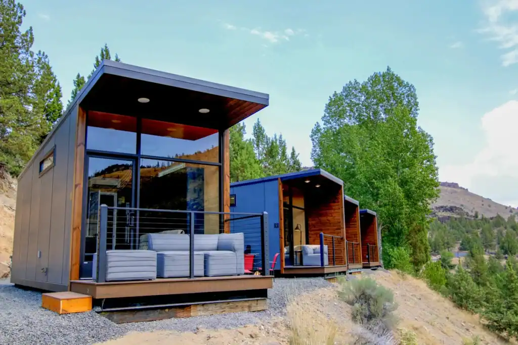 Modern tiny home builders developing prefabricated modular units for minimalist living.